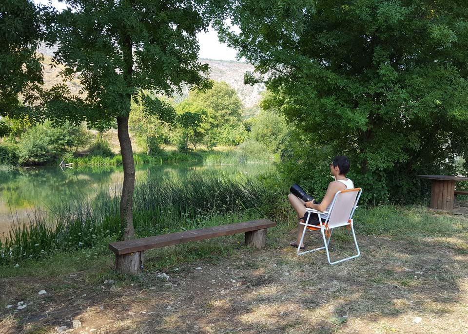 Elena taking picture next to the river, Buna, Bosnia